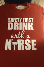 Load image into Gallery viewer, Safety first drink with a nurse t shirt
