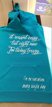 Load image into Gallery viewer, It wasnt easy but right now I'm living breezy, I'm on vaction every single day hoodie
